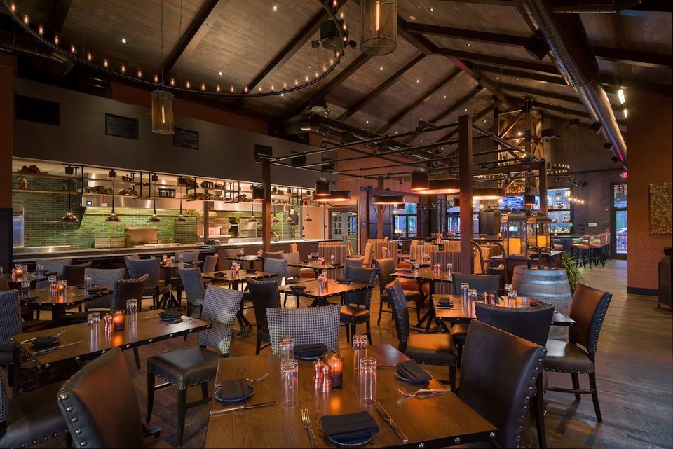 Wood-paneled dining room with tap handles behind the bar.